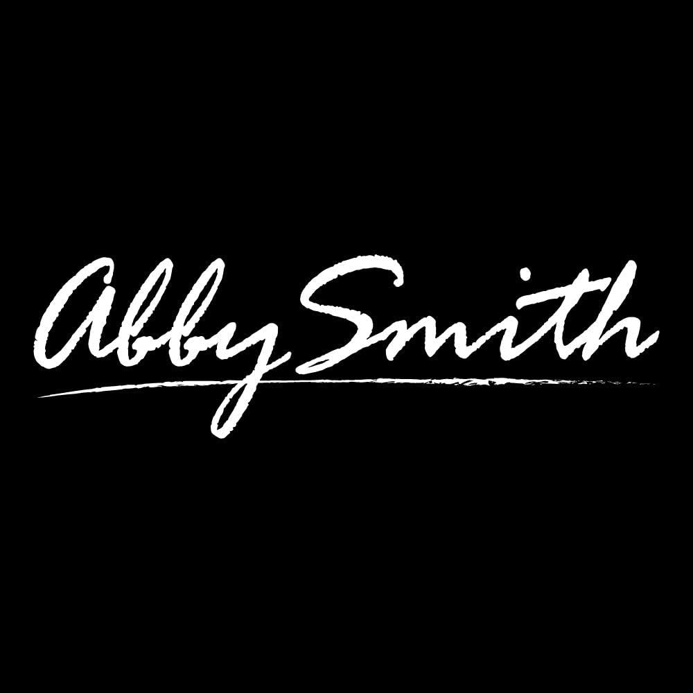 White handwritten text on black reads Abby Smith with a line underneath, offering perfect inspiration for personalizing the Ornate Monogram 26 oz. Classic Square Decanter and Rocks Glasses (Set of 5), Letter S.