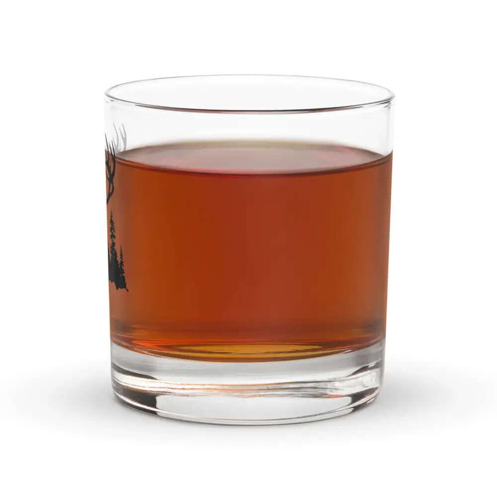 A 10.5 oz Deer Hunter Whiskey Glass, filled with dark amber bourbon, sits on a white background.
