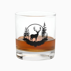 The 10.5 oz Deer Treeview Rocks Glass is a whiskey or bourbon glass featuring a black silhouette of a deer and trees on the side.