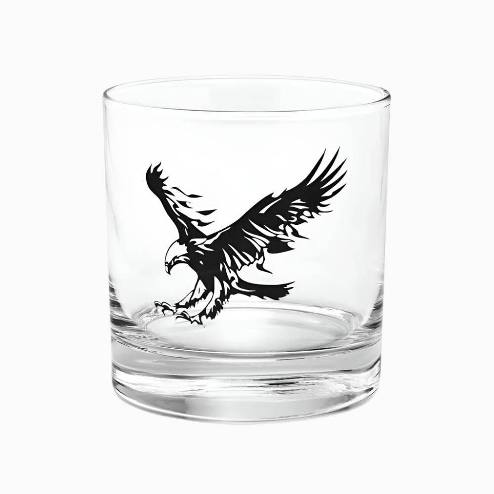 The 10.5 oz Eagle Rocks Glass is a whiskey and bourbon tumbler featuring a clear design with a bold black graphic of an eagle with outstretched wings on its side.