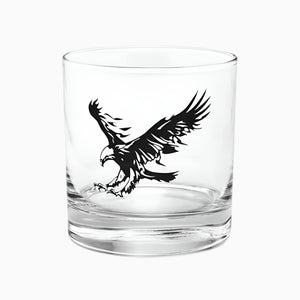 The 10.5 oz Eagle Rocks Glass is a whiskey and bourbon tumbler featuring a clear design with a bold black graphic of an eagle with outstretched wings on its side.