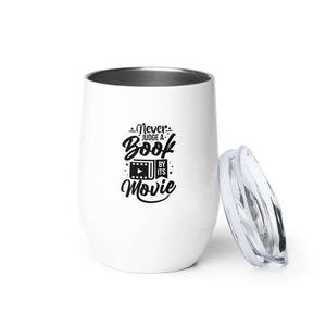 The 12 oz Never Judge A Book Wine Tumbler features white stainless steel, double-wall vacuum insulation, the printed phrase Never judge a book by its movie, and comes with a clear plastic lid.