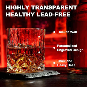 The Whiskey Stones Gift Set includes 2 whiskey glasses with thick walls, engraved designs, and heavy bases. Granite chilling whiskey rocks are included. A perfect gift for men or a stylish addition to any whiskey glass set. Red background with a bottle partially visible.