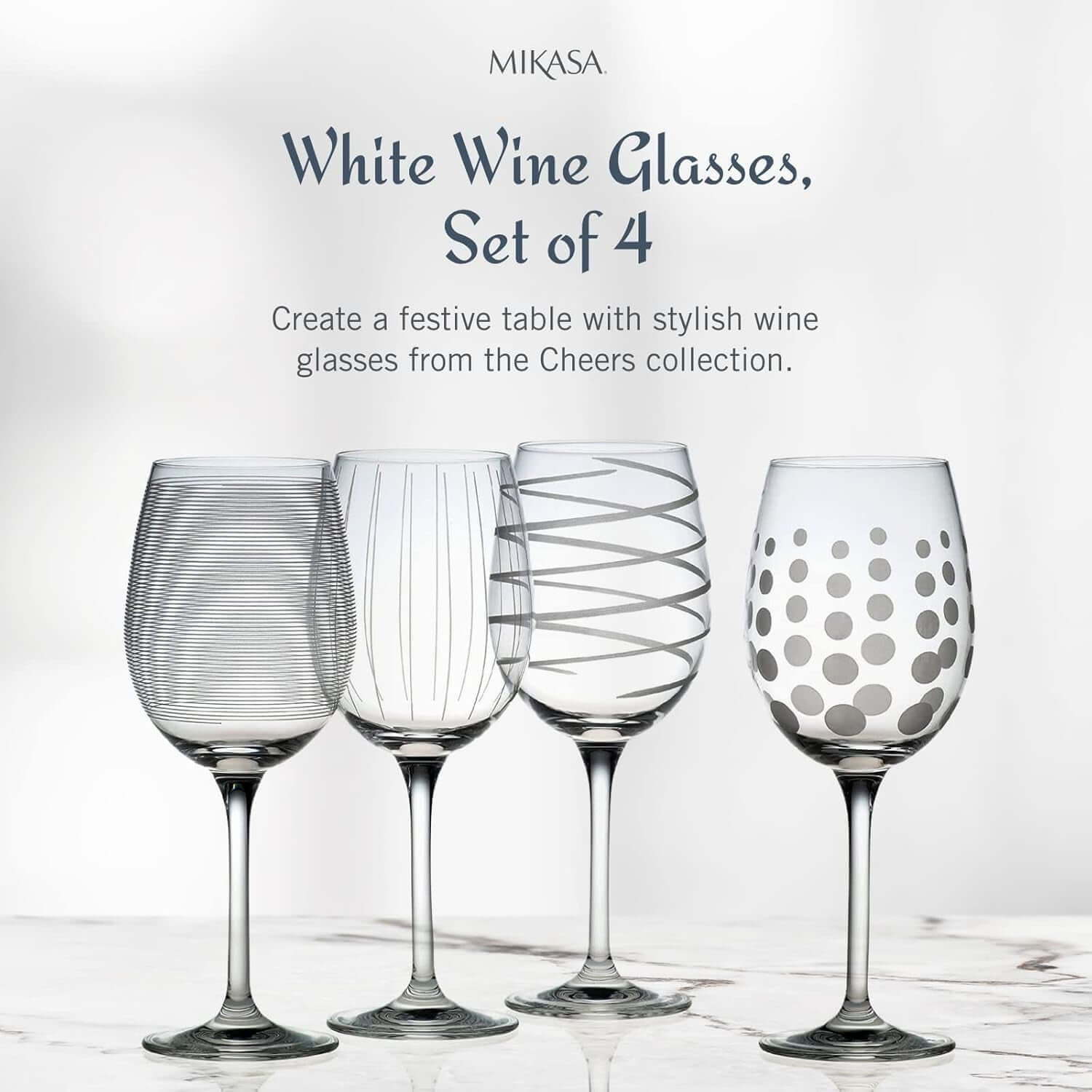 A set of four Mikasa Cheers White Wine Glasses, each 16 ounces and featuring a unique etched design, is displayed on a light surface with descriptive text highlighting their elegance.