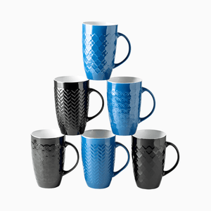 The Large Coffee Mugs Set of 6 (22oz ceramic) features three blue and three black mugs, each with a unique geometric pattern, arranged in a triangle pyramid on a white background. All mugs are lead and cadmium free for safe use.