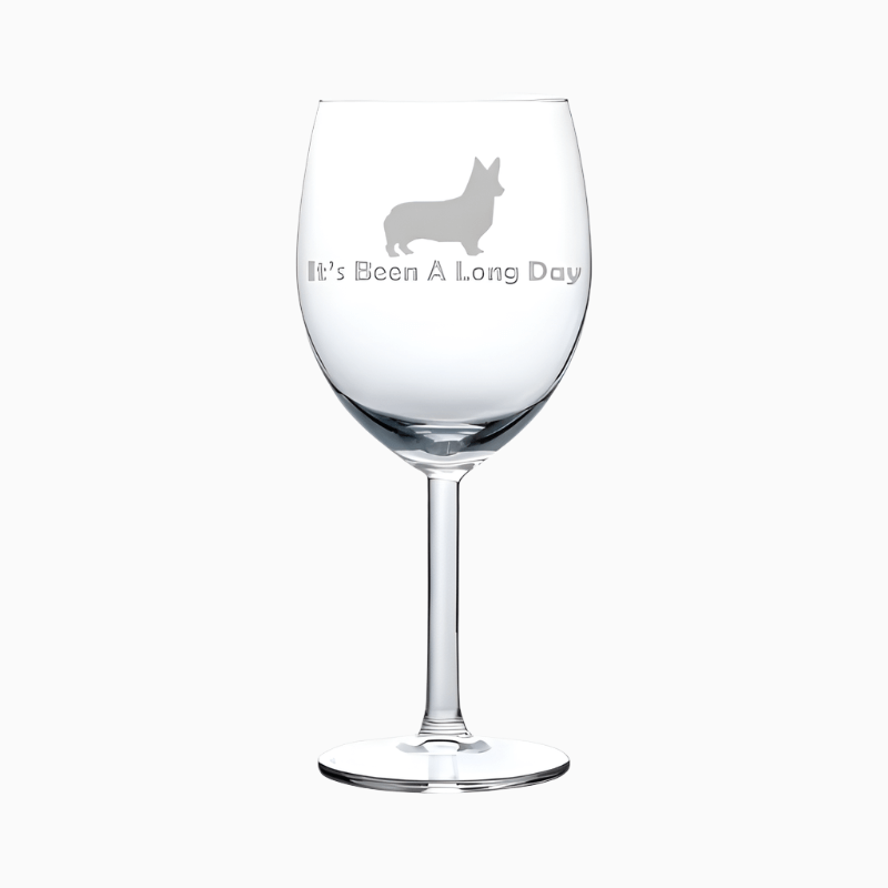 The Wine Glass Goblet Funny It's Been A Long Day Corgi (10 oz) features an etched corgi silhouette and the phrase "It's Been A Long Day"—a perfect, humorous wine glass gift for dog lovers.