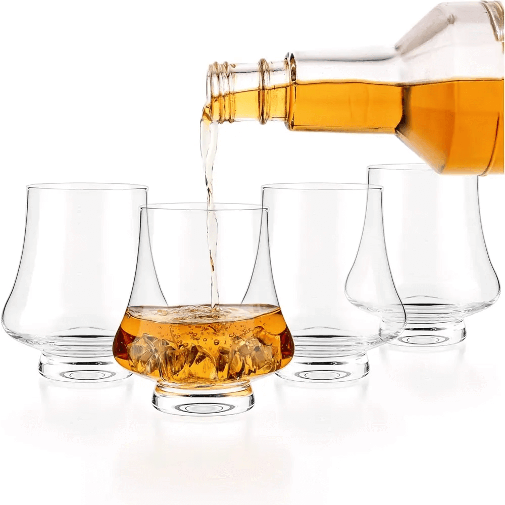 A Bourbon Whisky Crystal Glass Snifter, Set of 4 (9 Oz/260ml) is displayed, with one glass being filled and three empty glasses arranged behind it on a white background.