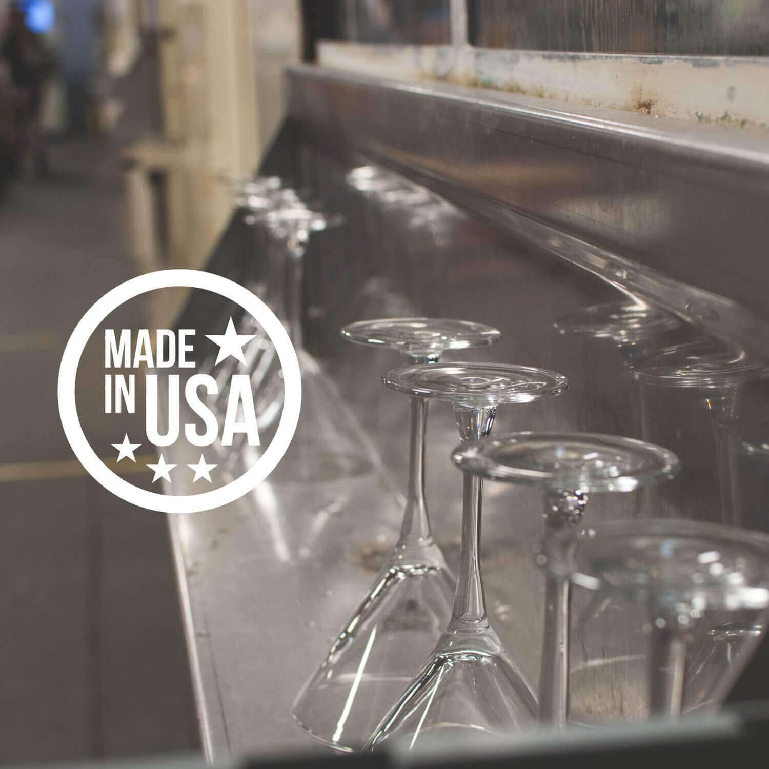 Four Palm Tree Martini Glasses (10oz, lead-free, stemmed) are drying upside-down on a metal rack, with a "Made in USA" label displayed on the left side of the image.
