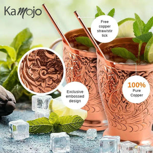 The Moscow Mule Pure Copper Mugs - Embossed Set is shown with ice, mint leaves, and straws, highlighting its pure copper material, exclusive embossed design, and includes 4 matching shot glasses.