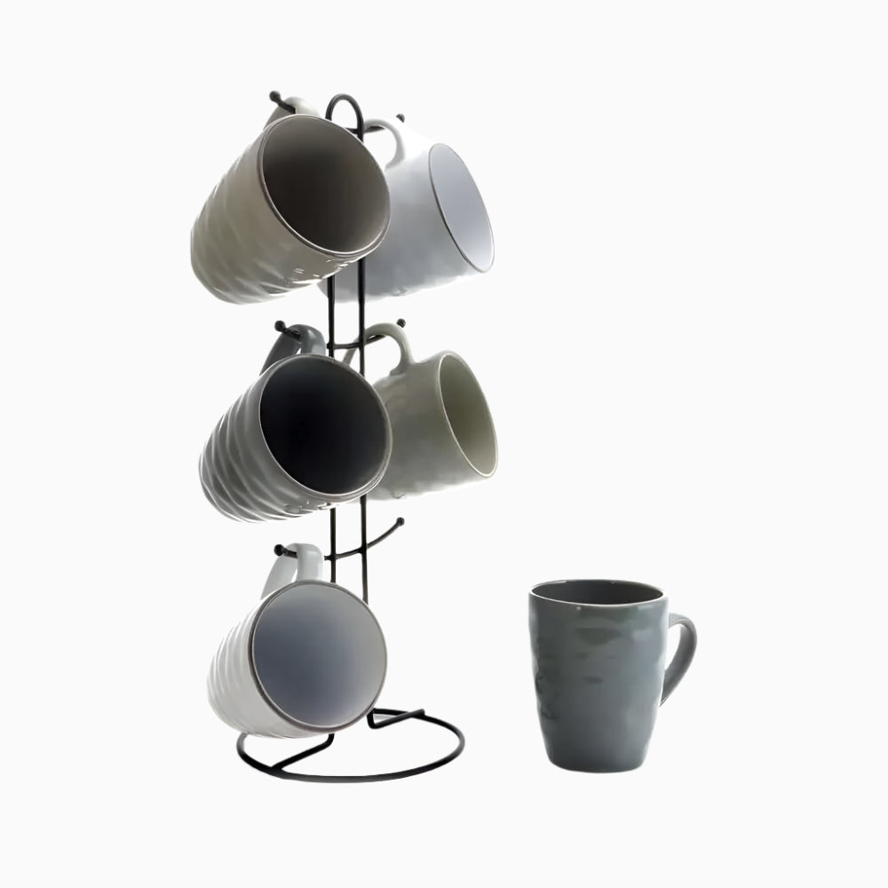 The Wave Series Mug Set, 7 Piece, Assorted Grey 2, includes five 12-ounce stoneware mugs—four hanging on a sleek black metal stand and one placed beside it—ideal for adding elegance to any modern kitchen.