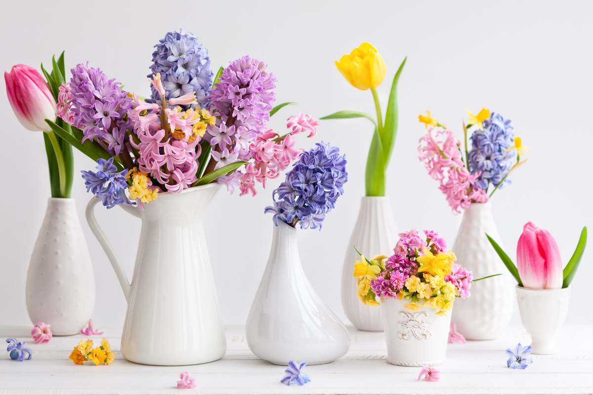 Image of white vases full with flowers