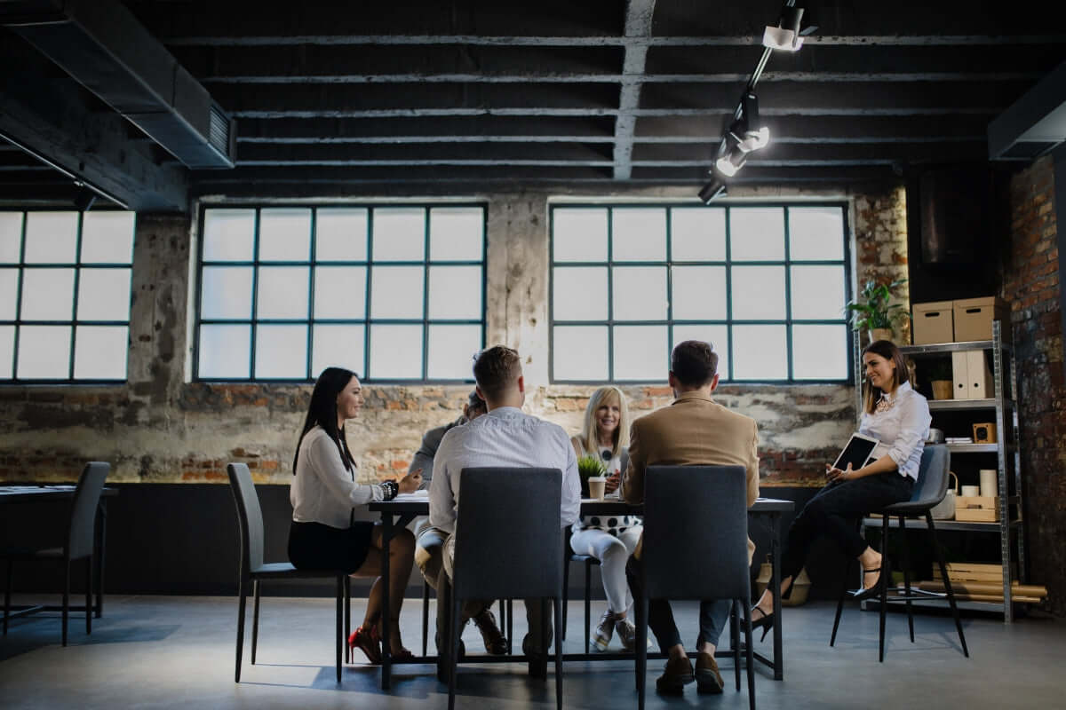 Image of a team sitting at a table