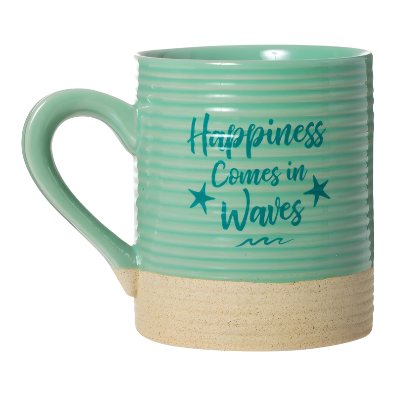 The 15oz Sandy Stoneware Pottery Mug (Turtle) is a mint green mug with a beige bottom, decorated with a coastal turtle design and the phrase Happiness Comes in Waves printed on the side in blue lettering.