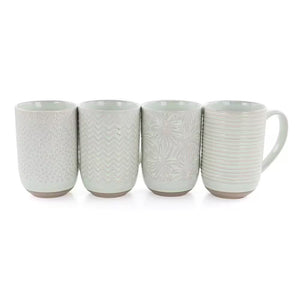 The Madrina 4 Piece 19 oz. Stoneware Assorted Designs Beverage Mug Set in Mint includes four microwave safe mugs, each with a unique textured pattern: dots, zigzags, leaves, and horizontal lines.