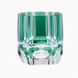 The Macchiaco Fashion Hand Carved Crystal Glass Cup features a faceted geometric design with green accents, highlighting modern simplicity. Photographed against a white background.