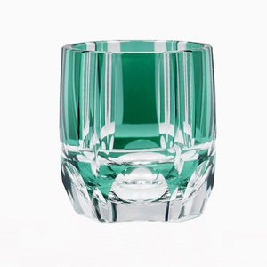 The Macchiaco Fashion Hand Carved Crystal Glass Cup features a faceted geometric design with green accents, highlighting modern simplicity. Photographed against a white background.