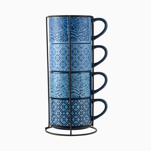 Four blue stoneware stacking mugs, each with a unique flower or shape pattern (11.1 fl oz), are held in a black metal rack.