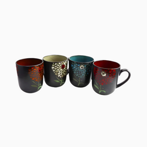 The Cafe 4-Piece Rustic Floral Vintage Earthenware Coffee Mugs 16oz set features black exteriors with vibrant floral designs and colorful interiors—red, green, blue, and red—arranged in a row on a white background.