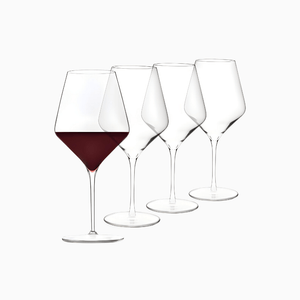 The Macchiaco Signature Greenwich 12 Piece Party Wine Glasses Set features elegantly designed glasses, pictured in a row on a white background with one glass filled with red wine and the others empty.