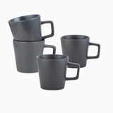 The Stoneware Coupe 4-piece mug set features grey matte 12oz mugs with square handles, arranged on a white surface—two stacked and two standing alone. These dishwasher-safe mugs offer the perfect blend of style and convenience.